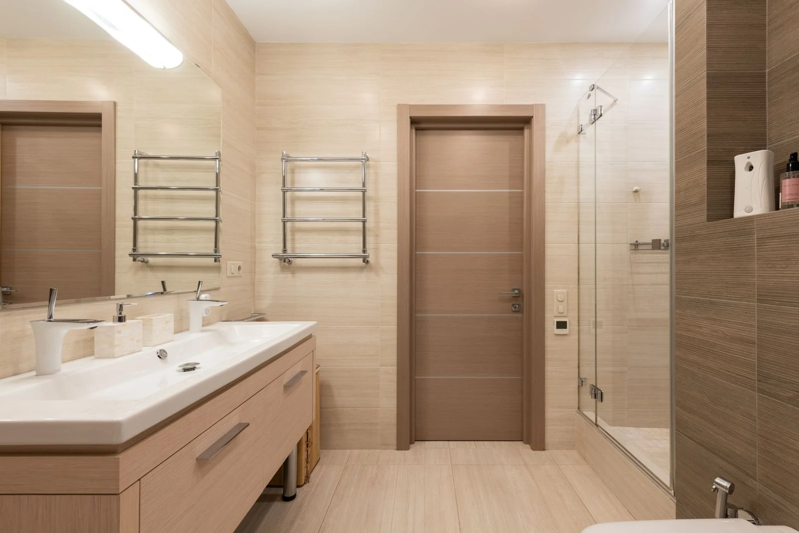 Spacious contemporary bathroom featuring sleek design and luxury amenities
